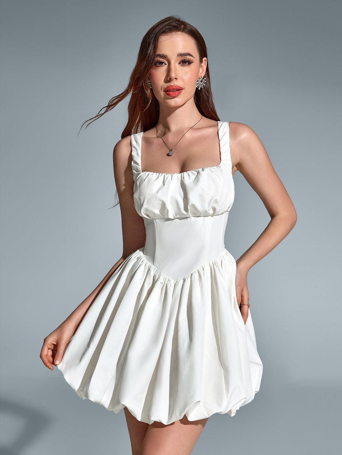 Woman wearing a white square neck party dress