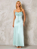 full length shot of a woman in a light blue satin maxi dress with a ruched neckline and spaghetti straps
