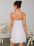 Back view of a white lace mini dress with a square neckline
