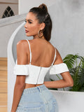 Back view of a woman in a white off-the-shoulder corset crop top with a zipper closure.