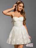 Woman wearing white embroidered floral sweetheart neckline spaghetti strap fit and flare dress posing with hand on head