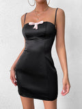 front detail of black satin mini dress