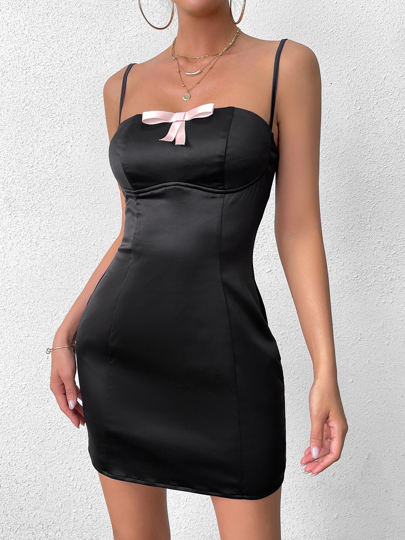 front detail of black satin mini dress