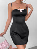 model wearing black satin mini dress with accessories