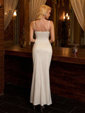 Rear view of a woman in a white satin column maxi dress, showcasing the back zipper detail.