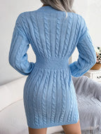 Back view of a blue cable knit sweater dress with a fitted waistband