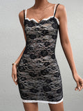 Front view of a woman in a black lace sheath dress with white trim.
