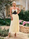 Back view of a woman in a pink strapless knee-length dress.