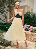 Side view of a woman wearing a pink tulle dress.