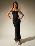 Woman in a gold sequined ruched skirt and a sheer corset-style top with spaghetti straps.