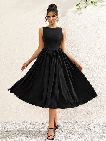 woman wearing a sleeveless black crepe midi dress with a boat neckline and flared skirt