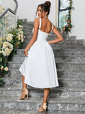 Rear view of a woman in a white sleeveless midi dress with a lace-up back, standing on stairs.