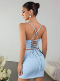 Back view of the light blue two-piece set showing the lace-up detail on the top.