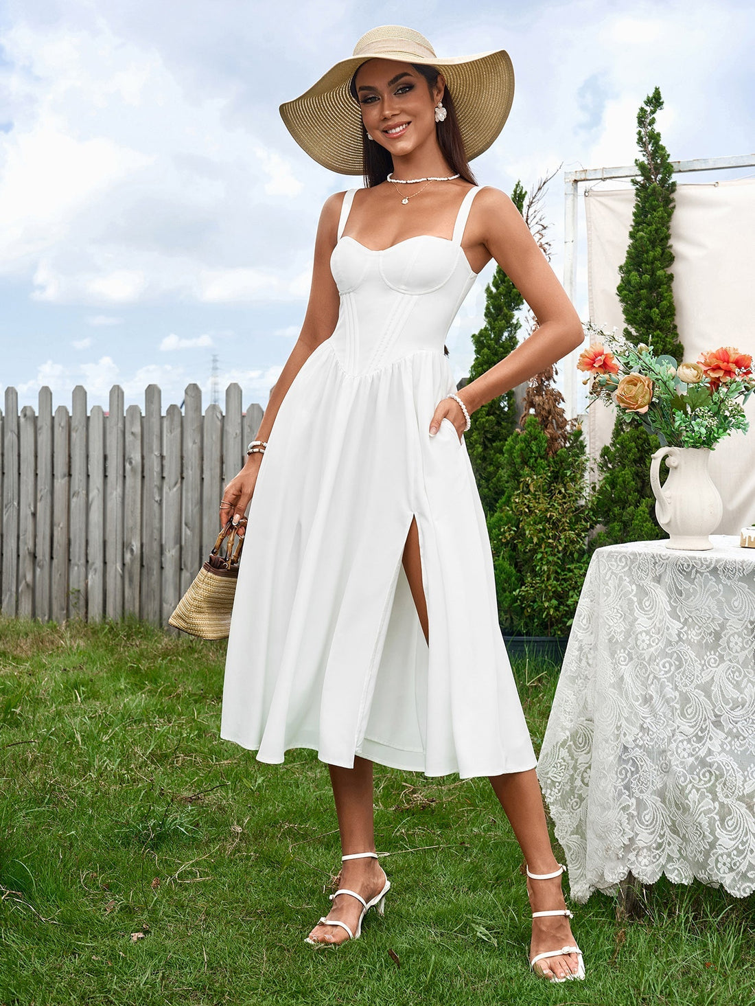 woman in white linen blend dress with corset bodice and high slit