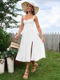 woman wearing a white linen blend dress and wide-brimmed hat