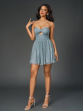 full body shot of a woman in a blue strapless party dress