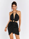 Woman wearing a black halter neck mini dress with cut-out waist detail and a ring accent.