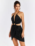Side profile of a woman in a black bodycon dress with ruched skirt and halter neckline.