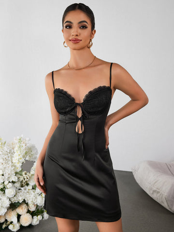 Black satin cami dress with lace bust and tie front