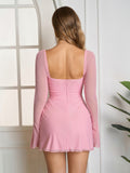 Back view of a pink lace up mesh mini dress
