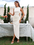 Woman holding a small cake while wearing a beige ruched midi dress