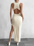 Back view of a beige fitted midi dress with an open back