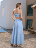 Back view of a blue maxi dress with an open back detail