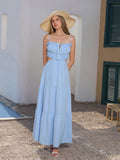 Model wearing a blue spaghetti strap maxi dress