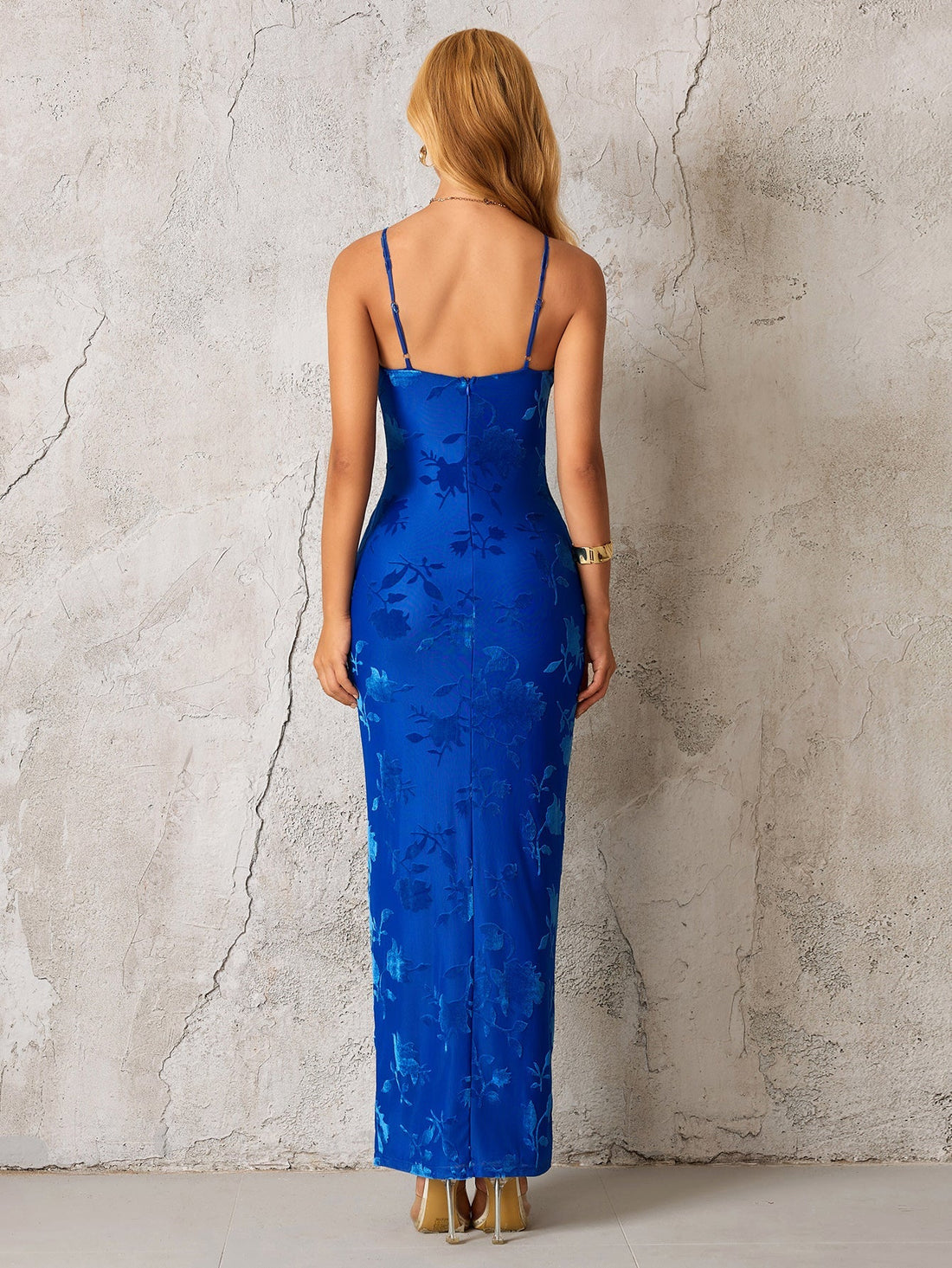 Model wearing a blue floral maxi dress with a tie front