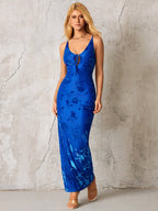 Full length shot of a woman in a blue floral maxi dress