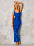 Model wearing a blue floral maxi dress with a tie front