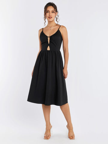 Woman wearing a black sleeveless cut out midi dress with a zipper back