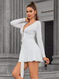 Side profile of model in white ruched tie front mini dress