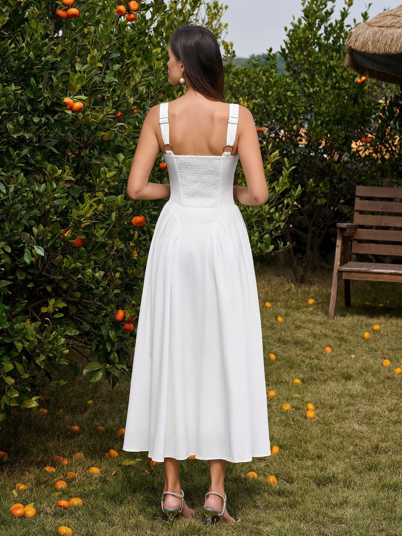 Back view of white ruched corset midi dress