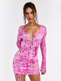 Close-up of the floral print and ruched detailing on a mini dress