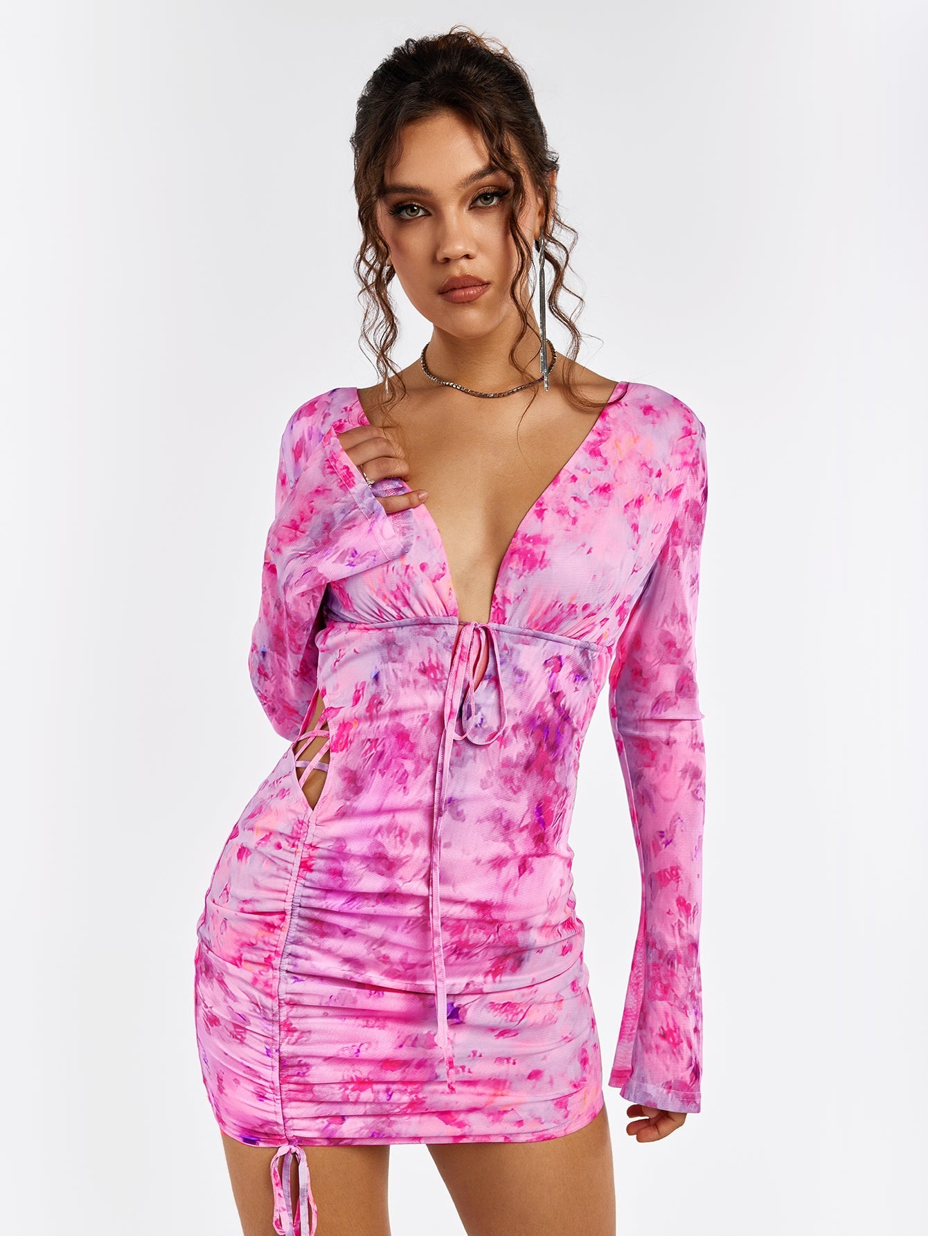 Close-up of the floral print and ruched detailing on a mini dress