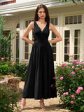 Close-up of the V-neck and bow tie detail on a black midi dress.