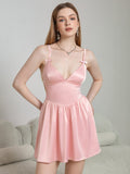 Model wearing pink satin cami dress