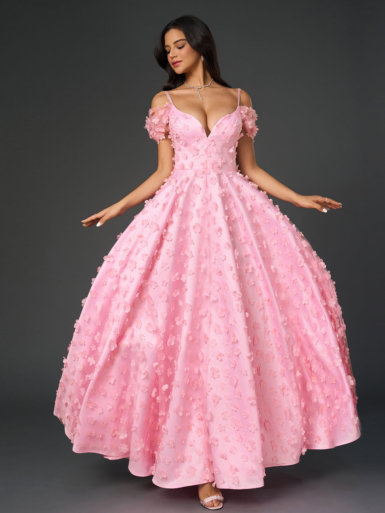 Model showcasing a formal pink jacquard dress with a V-neckline