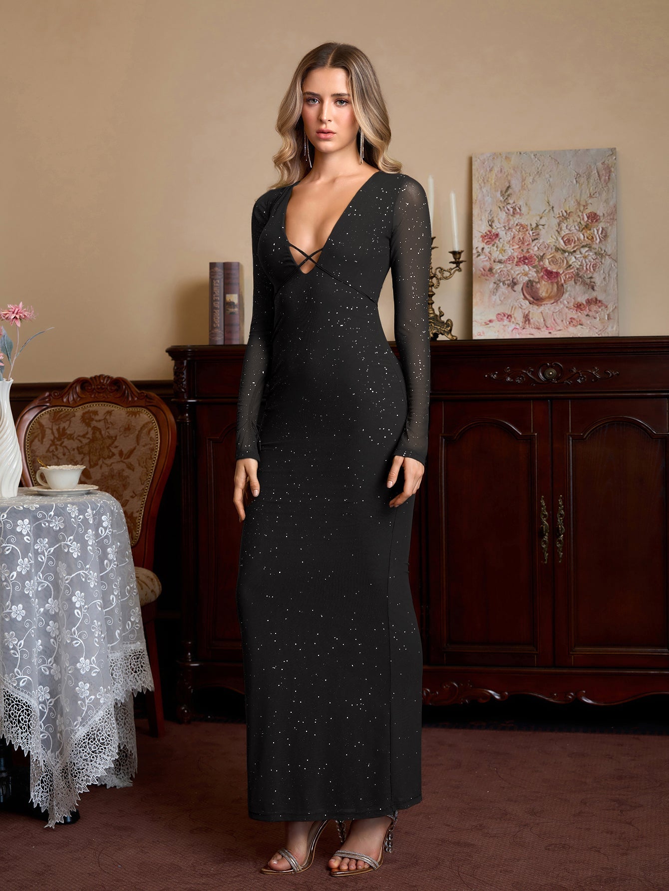 Full length view of a woman in a black glitter maxi dress