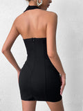 Back view of a black halter neck fitted dress with a zipper closure