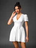 Model wearing white puff sleeve satin mini dress