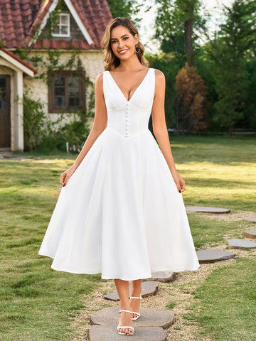 Woman wearing a white sleeveless maxi dress with V-neck and button front
