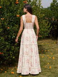 Back view of a woman in a floral print tiered maxi dress