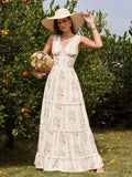 Woman holding a basket of flowers in a floral print maxi dress