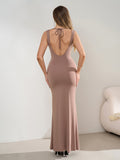 Back view of a taupe sleeveless maxi dress with an open tie-back design