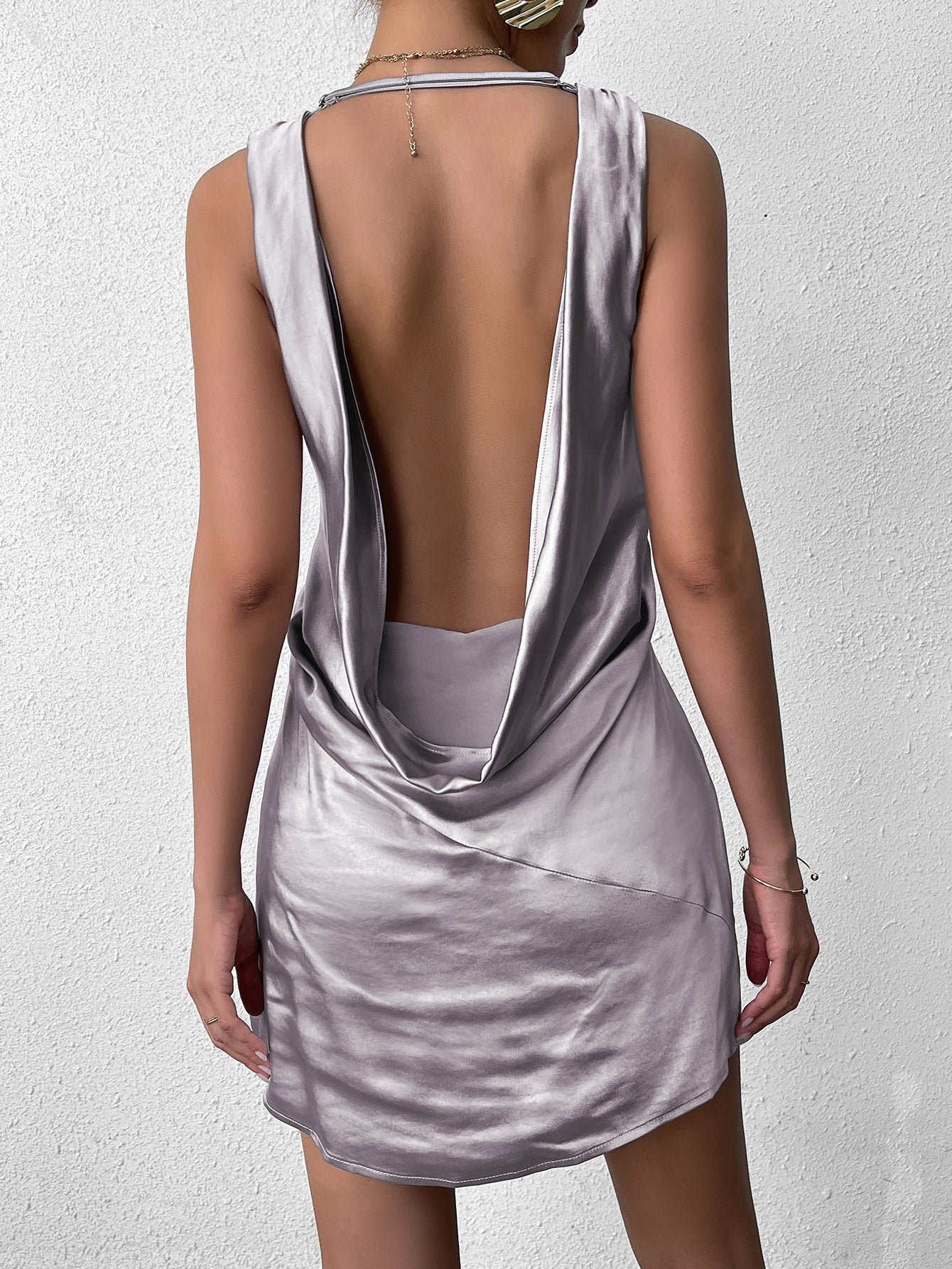 Front view of a grey satin V-neck mini dress.