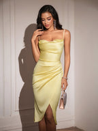 Model wearing a sophisticated yellow satin ruched midi dress