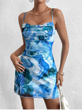 Woman wearing a blue floral print cami mini dress