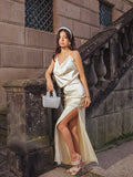 Full length shot of a woman in a white satin maxi dress with a thigh split